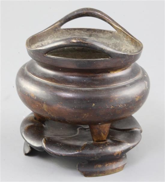 A Chinese bronze ding censer and stand, width 15.5cm